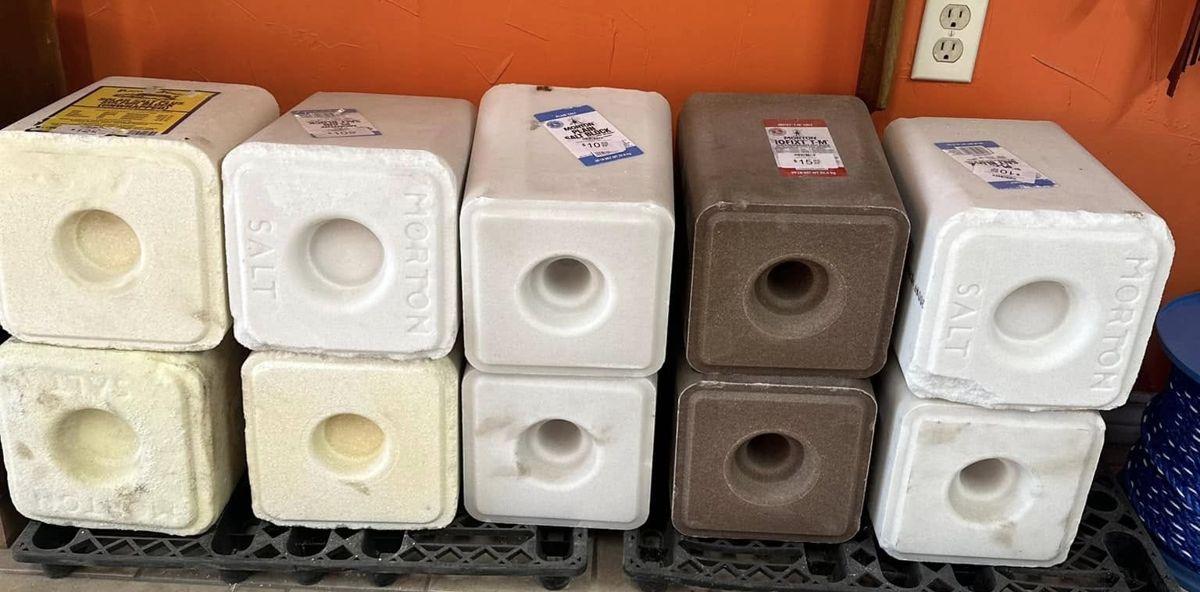 Morton plain salt and trace mineral blocks against an orange wall